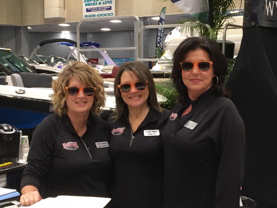 Boat Shows Are Always Fun (So much fun that you need to wear shades!) Ladies sales staff.