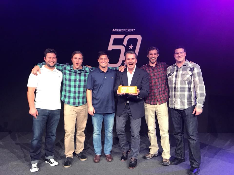 Sales team holding MasterCraft award